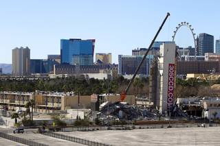 The remains of the Clarion Hotel and Casino, with elevator tower still standing, are shown after the building was imploded Tuesday, Feb. 10, 2015. The hotel, opened in 1970, was once owned by actress Debbie Reynolds and named the Debbie Reynolds Hollywood Hotel. A mixed-use resort, catering to convention-goers, is planned for the site, according to developer Lorenzo Doumani.
