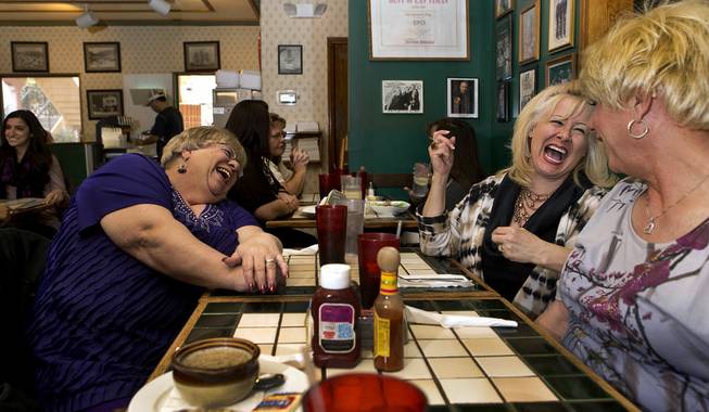 Toni Nesmith shares some laughs with friend Victoria Salisbury and spouse Holly Nesmith at the Coffee Pub on Tuesday, Jan. 27, 2015. 