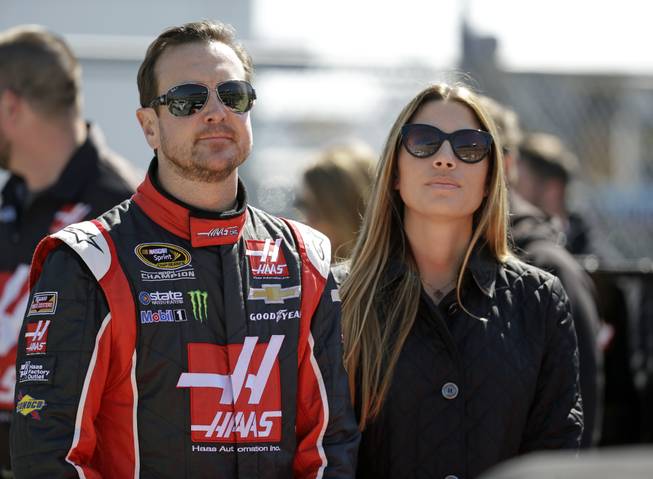 Driver Kurt Busch stands with his girlfriend Ashley Van Metre before getting in his car during qualifying for the Daytona 500 NASCAR Sprint Cup Series auto race at Daytona International Speedway, Sunday, Feb. 15, 2015, in Daytona Beach, Fla.
