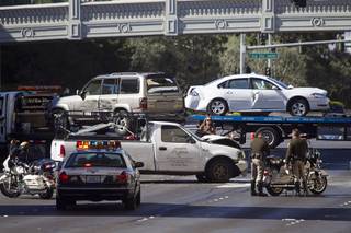 A stolen pickup truck, center, is shown after an accident at the Las Vegas Strip and Flamingo Road Tuesday, Feb. 17, 2015. Six vehicles were involved including the pickup truck and a RTC bus.