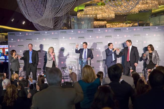Representatives from The Cosmopolitan of Las Vegas, Blackstone and Culinary Workers Union Local 266 raise a toast in celebration of The Cosmopolitan's new ownership by Blackstone, Wed. Feb 18, 2015.