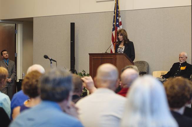 Virginia Valentine, President of Nevada Resort Association, addresses a public meeting about the conservation of Southern Nevada's public lands on Feb. 18, 2015. Tony Barron, Friends of Gold Butte Board President, waits to speak on her right.