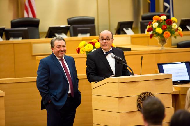 Tony Sanchez, of NV Energy, and Michael Brown, of Barrick Gold Corporation, speak during the fourth annual Philanthropy Leaders Summit, Friday Feb 6, 2015.