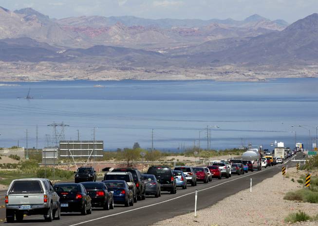 In this April 10, 2011, photo, traffic backs up heading southbound toward Lake Mead on U.S. Highway 93 in Boulder City. Hoover Dam, one of the world's great engineering feats, is marred by roads with traffic so jammed along the Nevada-Arizona border that it tells a different story about the political will to maintain 21st century infrastructure.