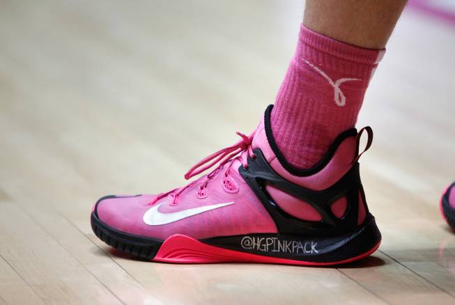 The shoe of New Mexico starting guard Hugh Greenwood displays the name of his Twitter account to raise money and awareness for breast cancer research during an NCAA college basketball game against UNLV on Saturday, Feb. 21, 2015, in Albuquerque. Greenwood started the “Pink Pack” foundation in honor of his mother, who has breast cancer for a second time.