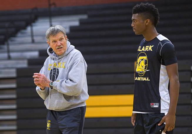 David Svendsen, 75, a Clark High School basketball coach, talks with Amir Boone during practice at the school Monday, Feb. 23, 2015. The defending state champs play Lowry High School (Winnemucca) in the Division 1A state semifinals at Silverado at 8 p.m. Friday.