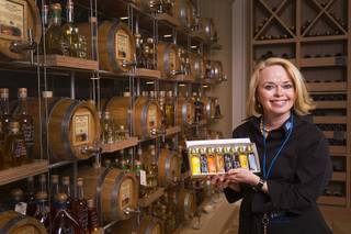 Owner Kim Weiss poses in VOM FASS at the Grand Canal Shoppes in the Venetian Tuesday, Feb. 24, 2015. The store sells whiskeys and liqueurs on tap and lets shoppers sample them before purchasing. The company also sells wine, specialty oils and vinegars.