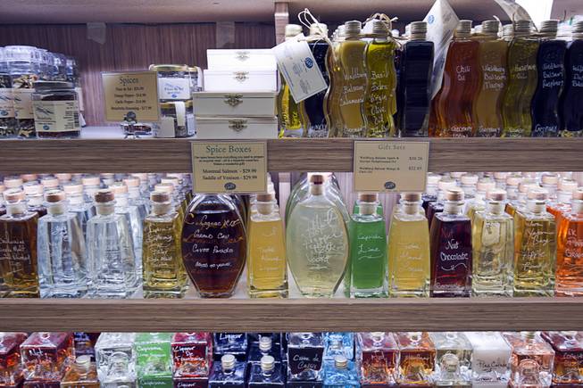 Bottles of alcohol and specially oils are displayed in VOM FASS at the Grand Canal Shoppes in the Venetian Tuesday, Feb. 24, 2015. The store sells whiskeys and liqueurs on tap and lets shoppers sample them before purchasing. The company also sells wine, specialty oils and vinegars.