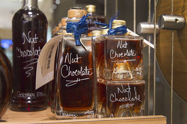 Bottles of nut chocolate liqueur are displayed in VOM FASS at the Grand Canal Shoppes in the Venetian Tuesday, Feb. 24, 2015. The store sells whiskeys and liqueurs on tap and lets shoppers sample them before purchasing. The company also sells wine, specialty oils and vinegars.