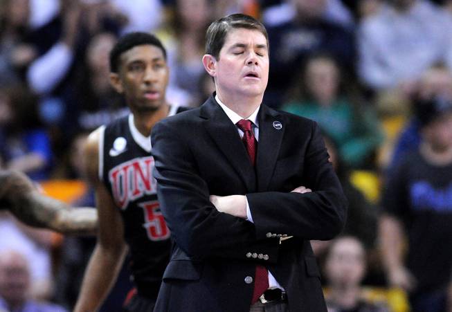 UNLV coach Dave Rice reacts to a foul during the second half of an NCAA college basketball game against Utah State, Tuesday, Feb. 24, 2015, in Logan, Utah. 