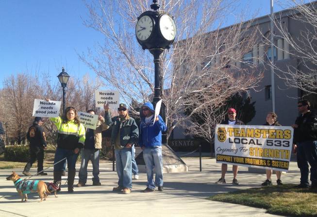 Construction workers rally outside the Nevada Senate on Thursday, Feb. 26, 2015, as lawmakers consider a bill that would eliminate the prevailing wage requirement for some state building jobs.