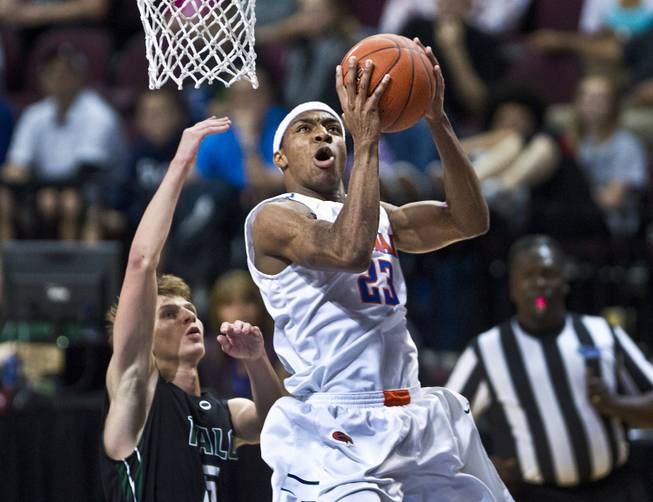 Bishop Gorman's Nick Blair (23) sets for a lay up over Palo Verde's Grant Dressler (5) during the state basketball championship game on Friday, Feb. 27, 2015.
