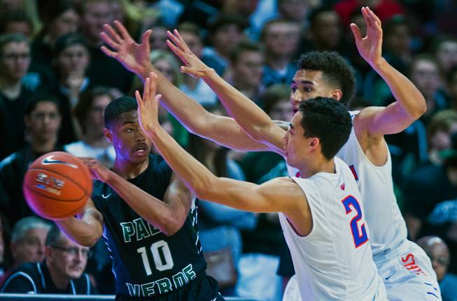 Palo Verde's Ja Morgan (10) looks for an outlet pass around Bishop Gorman's Richie Thornton (2) and Chase Jeter (4) during the NIAA Division 1 State Basketball Championships on Friday, February, 27, 2015.