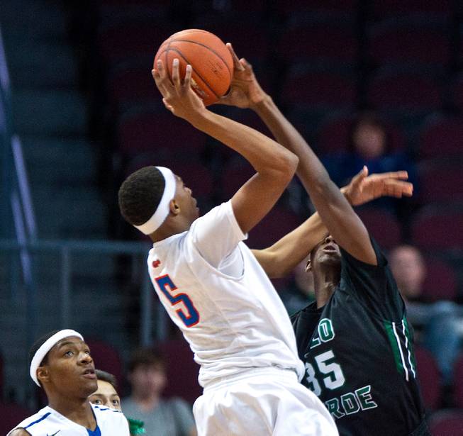 Bishop Gorman's Charles O'Bannon Jr., fouls Palo Verde's Jameel Garcia-Williams (35) who also gets the block during the NIAA Division 1 State Basketball Championships on Friday, February, 27, 2015.