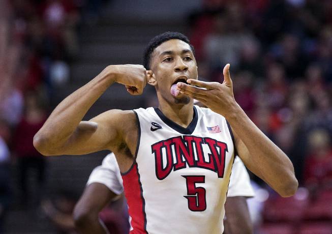 UNLV forward Christian Wood motions that he's eating up the Wyoming defense Saturday, Feb. 28, 2015. 