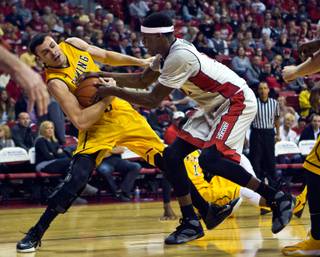 Wyoming forward Larry Nance Jr., left, fights to keep possession of the ball as UNLV forward Goodluck Okonoboh does his best to strip it away Saturday, Feb. 28, 2015.