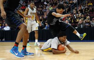 Clark High School forward Ty'rek Wells (13) grabs a loose ball against Desert Pines during the Division I-A Nevada high school basketball state championship game  at the Orleans Arena on Saturday, Feb. 28, 2015.