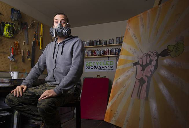 Artist Izaac Zevalking stand in his studio Sunday, March 1, 2015, in Summerlin. Zevalking, the artist behind Recycled Propaganda, will be celebrating two years of being with First Friday on March 6.