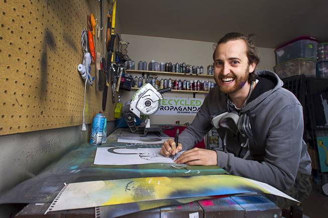 Artist Izaac Zevalking works in his studio Sunday, March 1, 2015, in Summerlin. Zevalking, the artist behind Recycled Propaganda, will be celebrating two years of being with First Friday on March 6.