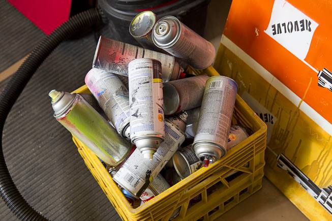 Empty spray paint cans are shown in artist Izaac Zevalking's studio Sunday, March 1, 2015, in Summerlin. Zevalking, the artist behind Recycled Propaganda, will be celebrating two years of being with First Friday on March 6.