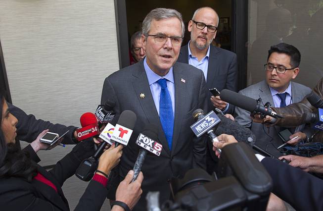 Former Florida Gov. Jeb Bush speaks with reporters after a question and answer session at the Mountain Shadows Community Center in Las Vegas Monday, March 2, 2015.