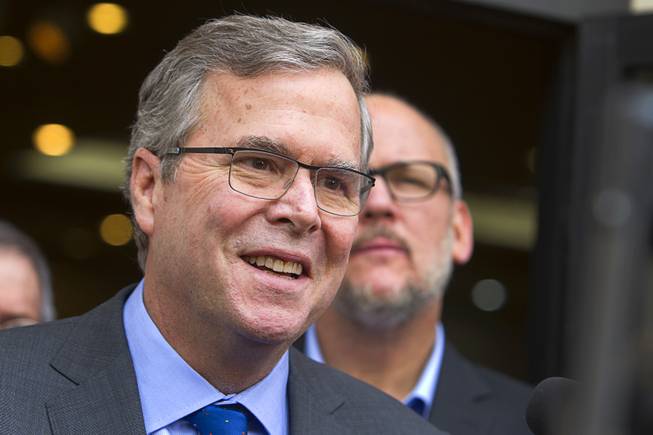 Former Florida Gov. Jeb Bush speaks with reporters after a discussion and question and answer session at the Mountain Shadows Community Center in Las Vegas Monday, March 2, 2015.