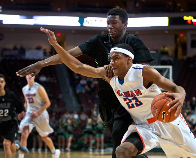 Bishop Gorman's Nick Blair (23) fights for position inside of Palo Verde's Jameel Garcia-Williams (35) during the NIAA Division 1 State Basketball Championships on Friday, February, 27, 2015.