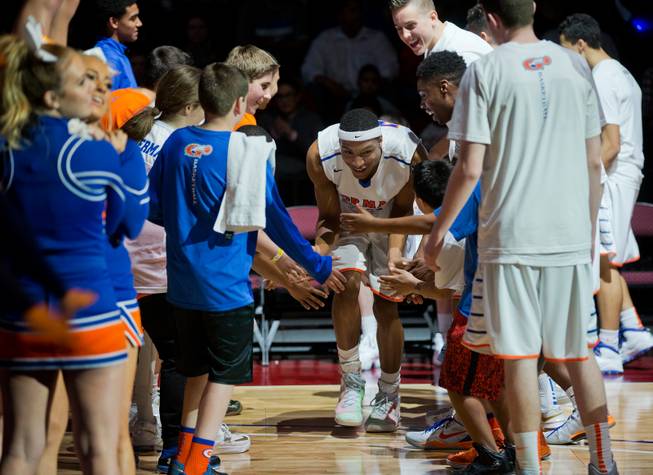 Bishop Gorman's Nick Blair (23) is welcomed onto the court as they face Palo Verde during the NIAA Division 1 State Basketball Championships on Friday, February, 27, 2015.