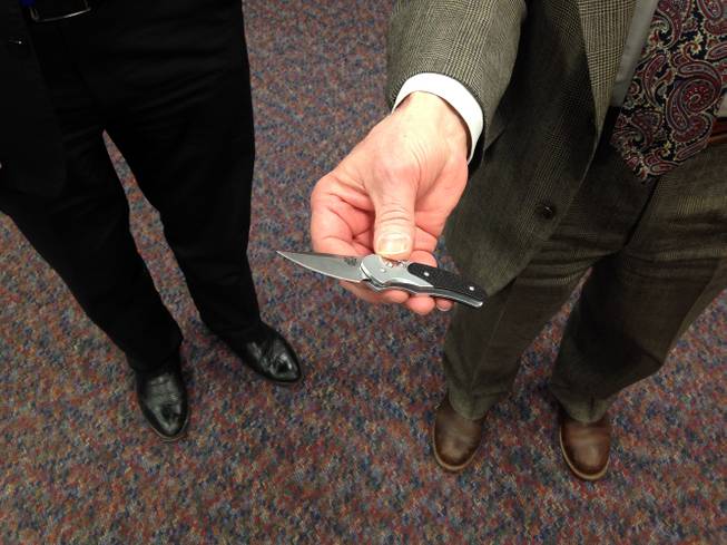 Daniel Lawson, a lobbyist for the American Knife and Tool Institute, holds a knife with a two-inch blade that he says is much more of a tool than it is a deadly weapon. 
