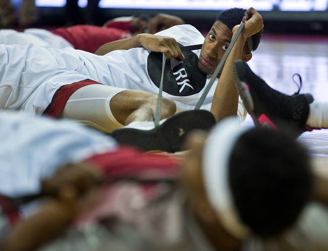 UNLV forward Christian Wood (5) stretches with teammates before they face San Diego State at the Thomas & Mack Center in Las Vegas on Wednesday, March 4, 2015. 