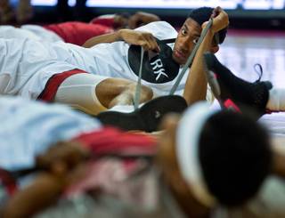 UNLV forward Christian Wood (5) stretches with teammates before they face San Diego State at the Thomas & Mack Center in Las Vegas on Wednesday, March, 4, 2015.