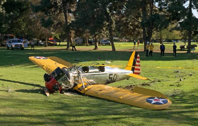 A small plane lies where it crash-landed on Penmar Golf Course in the Venice area of Los Angeles on Thursday, March 5, 2015. The course is near the Santa Monica Municipal Airport just west of a runway. 