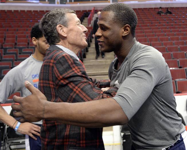 Craig Sager, left, gets a hug from Oklahoma City Thunder guard Dion Waiters, right, before the game between the Chicago Bulls and the Oklahoma City Thunder. Sager returns to broadcasting as a sideline reporter for TNT tonight at the Bulls game in Chicago. He’s been out all season recovering from leukemia, Thursday, March 5, 2015. 