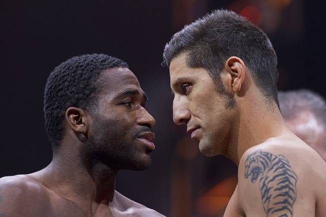 Super lightweight boxers Adrien Broner, left, of Cincinnati, Ohio and John Molina of Covina, Calif. face off during an official weigh-in at the MGM Grand Garden Arena Friday, March 6, 2015. The fight will be broadcast live on NBC Sports Network Saturday, March 7.