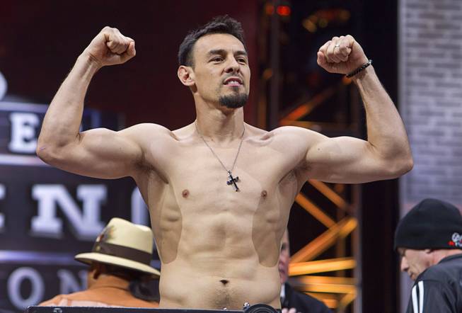 Welterweight boxer Robert Guerrero of Gilroy, Calif. poses on the scale during an official weigh-in at the MGM Grand Garden Arena Friday, March 6, 2015. Guerrero will challenge WBA welterweight champion Keith Thurman of Clearwater, Fla. at the arena Saturday. The fight will be broadcast live on NBC Sports Network.
