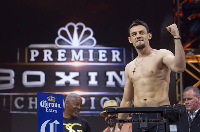 Welterweight boxer Robert Guerrero of Gilroy, Calif. poses on the scale during an official weigh-in at the MGM Grand Garden Arena Friday, March 6, 2015. Guerrero will challenge WBA welterweight champion Keith Thurman of Clearwater, Fla. at the arena Saturday. The fight will be broadcast live on NBC Sports Network.