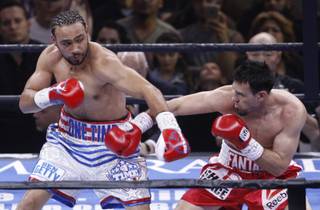 WBA welterweight champion Keith Thurman, left, of Clearwater, Fla., and Robert Guerrero of Gilroy, Calif., exchange punches during their title fight in the Premier Boxing Champions event at  MGM Grand Garden Arena on Saturday, March 7, 2015.