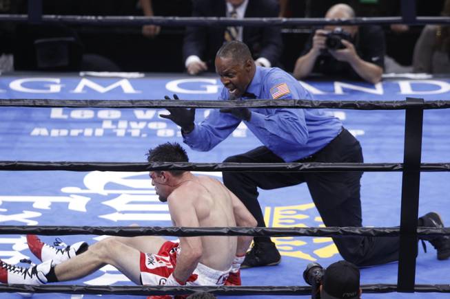 Referee Kenny Bayless gives Robert Guerrero the count after he was knocked down by Keith Thurman during their title fight in the Premier Boxing Champions event at MGM Grand Garden Arena on Saturday, March 7, 2015.