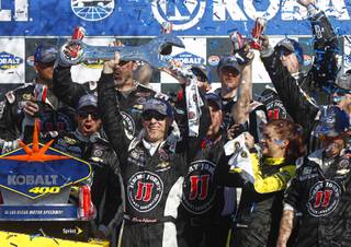 Kevin Harvick celebrates with his team in victory lane after winning the NASCAR Sprint Cup Series Kobalt 400 on Sunday, March 8, 2015, at Las Vegas Motor Speedway.
