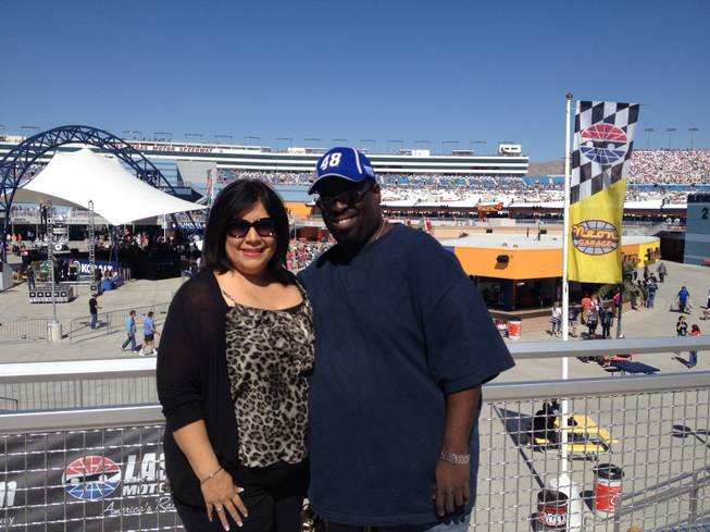 Race fans Drew Strickland, left, and Isabel Alvarez before the Kobalt 400 Sprint Cup Series race at the Las Vegas Motor Speedway on Sunday, March 8, 2015.