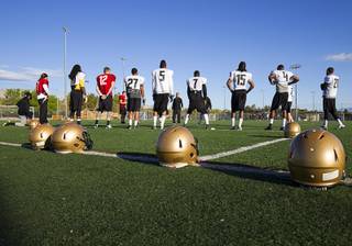 Coach Aaron Garcia, center, talks to players during Las Vegas Outlaws Arena Football team practice at the Summerlin Soccer Complex Thursday, March 12, 2015. The team will open their season at the Thomas & Mack Center against the San Jose SaberCats on March 30.