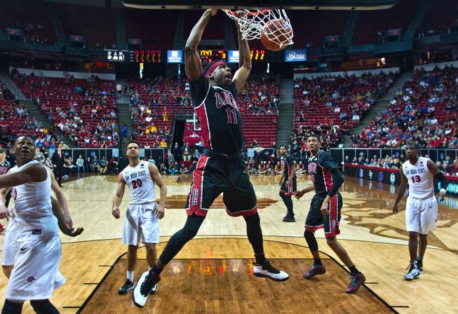 UNLV forward Goodluck Okonoboh (11) dunks the ball with authority over San Diego State during their Mountain West Men's Championship game on Thursday, March, 12, 2015.