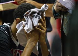 UNLV forward Christian Wood (5) places a towel over his face in a late-game huddle as San Diego State pulls away during their Mountain West Men's Championship game on Thursday, March, 12, 2015.