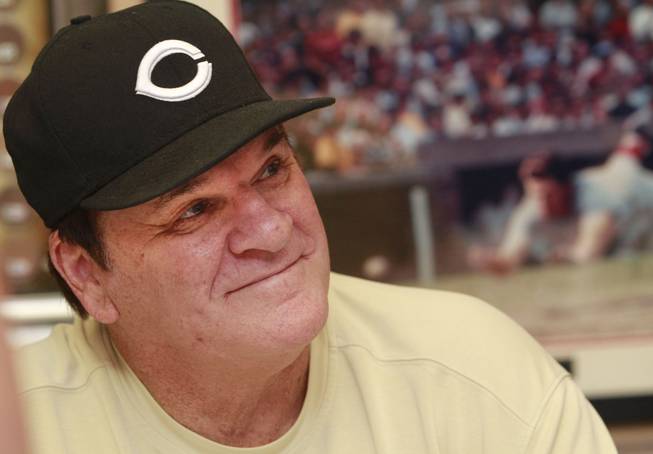 In this July 26, 2011, file photo, former Cincinnati Reds player Pete Rose signs autographs at the Collectors Den in a mall in Indianapolis.