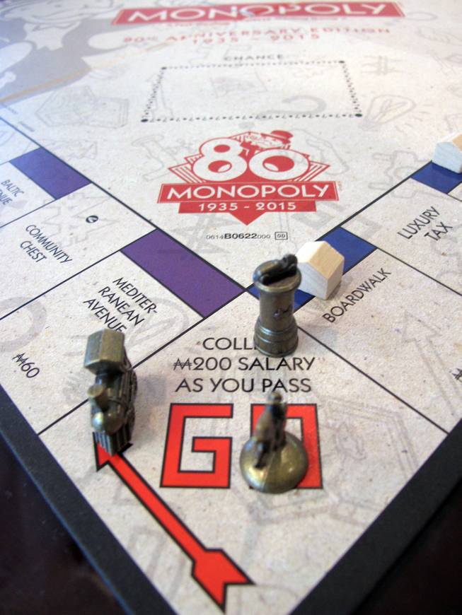 This March 11, 2015, photo shows a Monopoly board in Atlantic City, the city on whose real-life streets the Monopoly board game is based. The board game turns 80 years old on Thursday, March 19, 2015. ()