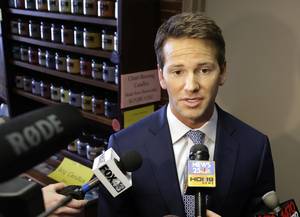 In this Feb. 6, 2015, file photo, Rep. Aaron Schock, R-Ill. speaks to reporters in Peoria, Ill. Schock announced Tuesday his resignation amid questions about spending.