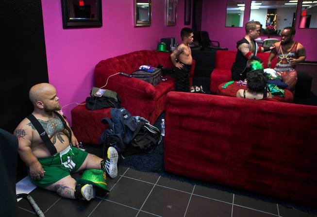 Performers chill in the dressing room as they ready for more during the St. Patricks Day Leprechaun Smackdown by Midgets Unleashed at the Fremont Country Club on Tuesday, March, 17, 2015.