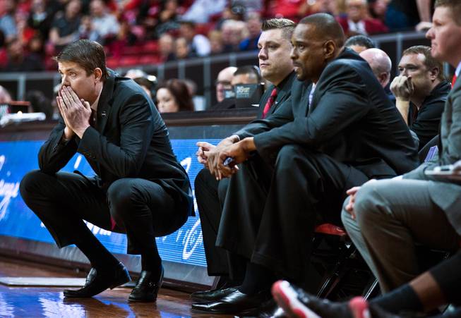 UNLV head coach Dave Rice, left, has watched his team’s win totals decline each year he has coached the Rebels — from 26 in 2011-12 to 25 in his second season, then 20 in his third and 18 this year, which was the first time the Rebels finished their conference slate under .500.