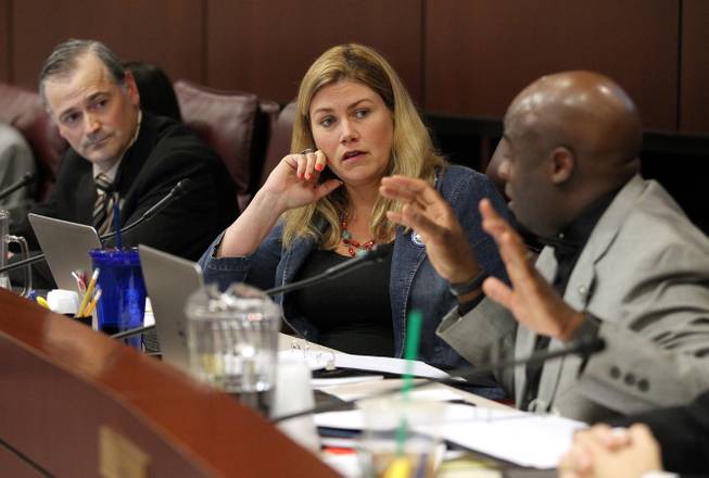 Nevada Senate Commerce committee members, from left, James Settelmeyer, R-Minden, Patricia Farley, R-Las Vegas, and Kelvin Atkinson, D-Las Vegas, debate a move to increase Nevada's minimum wage during a hearing at the Legislative Building in Carson City on Friday, March 20, 2015. 