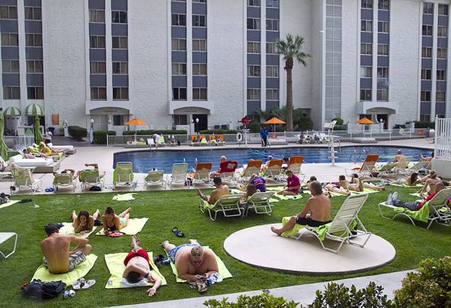 Guests relax by the pool at the Riviera Sunday, March 22, 2015. The casino is scheduled to close on May 4 and be demolished to make way for a Las Vegas Convention Center expansion.